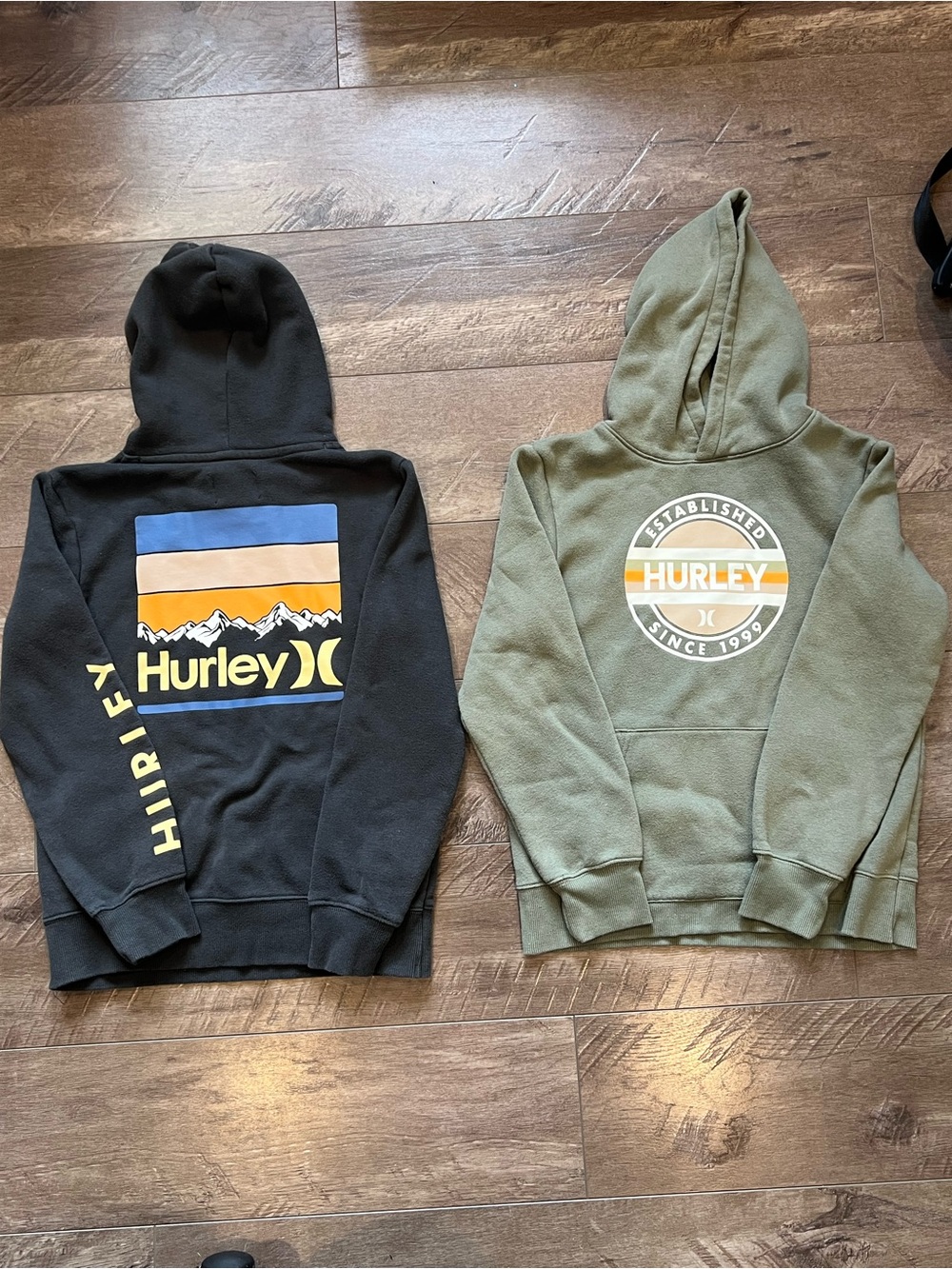 2 Hurley Kids Hoodies in Black and Olive with Retro Logo Graphics Size M (10/12)